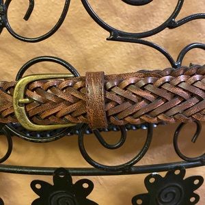 Brown woven belt with brass hardware with black lining